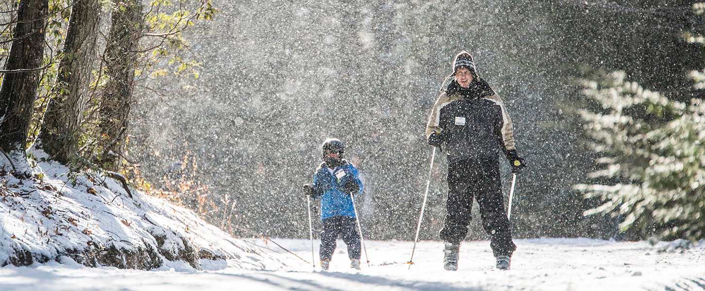 Hero image from Ski Sundown’s website, featuring an expansive view of a mountain range, promoting winter sports and adventure.